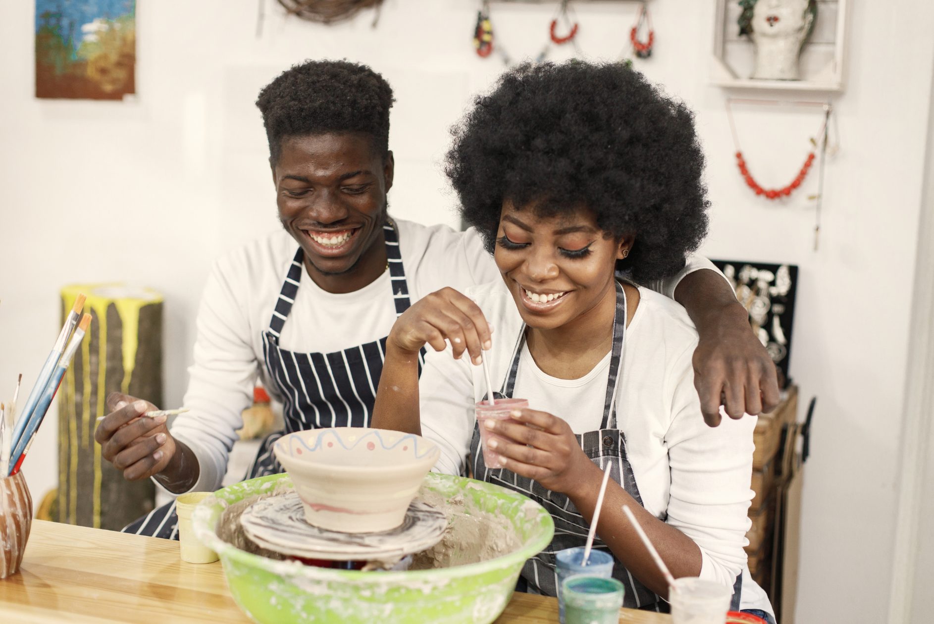 A couple painting pottery